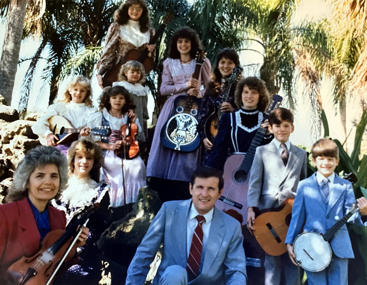 Marshall family under palm trees at Colonial Hills Baptist Church, Bradenton, Florida